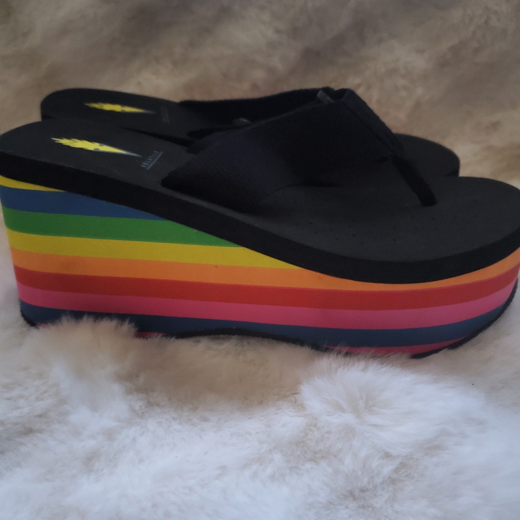 Black platform flip-flops with a rainbow-striped wedge sole, one secondhand listing among many identically titled ones